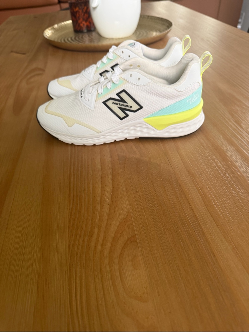 New Balance woman’s White Mesh Sneakers with Yellow & Aqua Accents